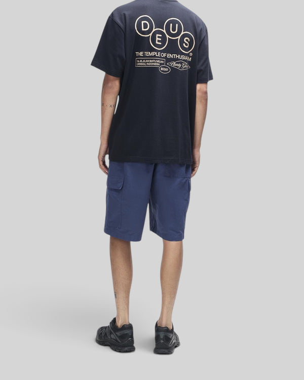 Baffle Haus black short sleeve cotton t-shirt with graphic print on back worn with blue cargo shorts