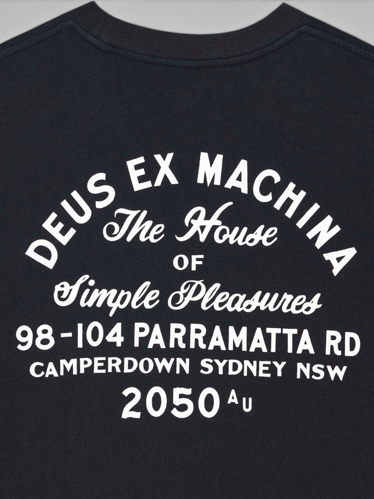 Baffle Haus black organic cotton t-shirt featuring white graphic print on the back with vintage typography