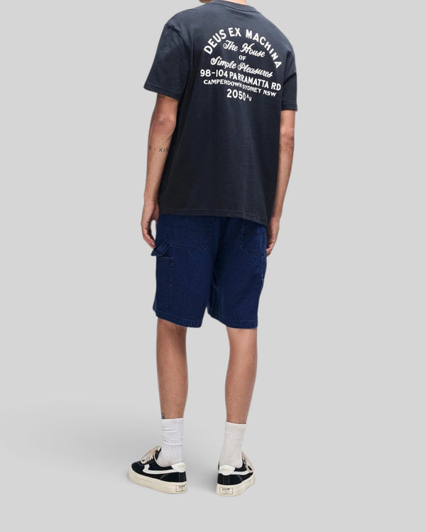 Baffle Haus black box fit t-shirt with white back graphic print worn with dark blue denim shorts and sneakers
