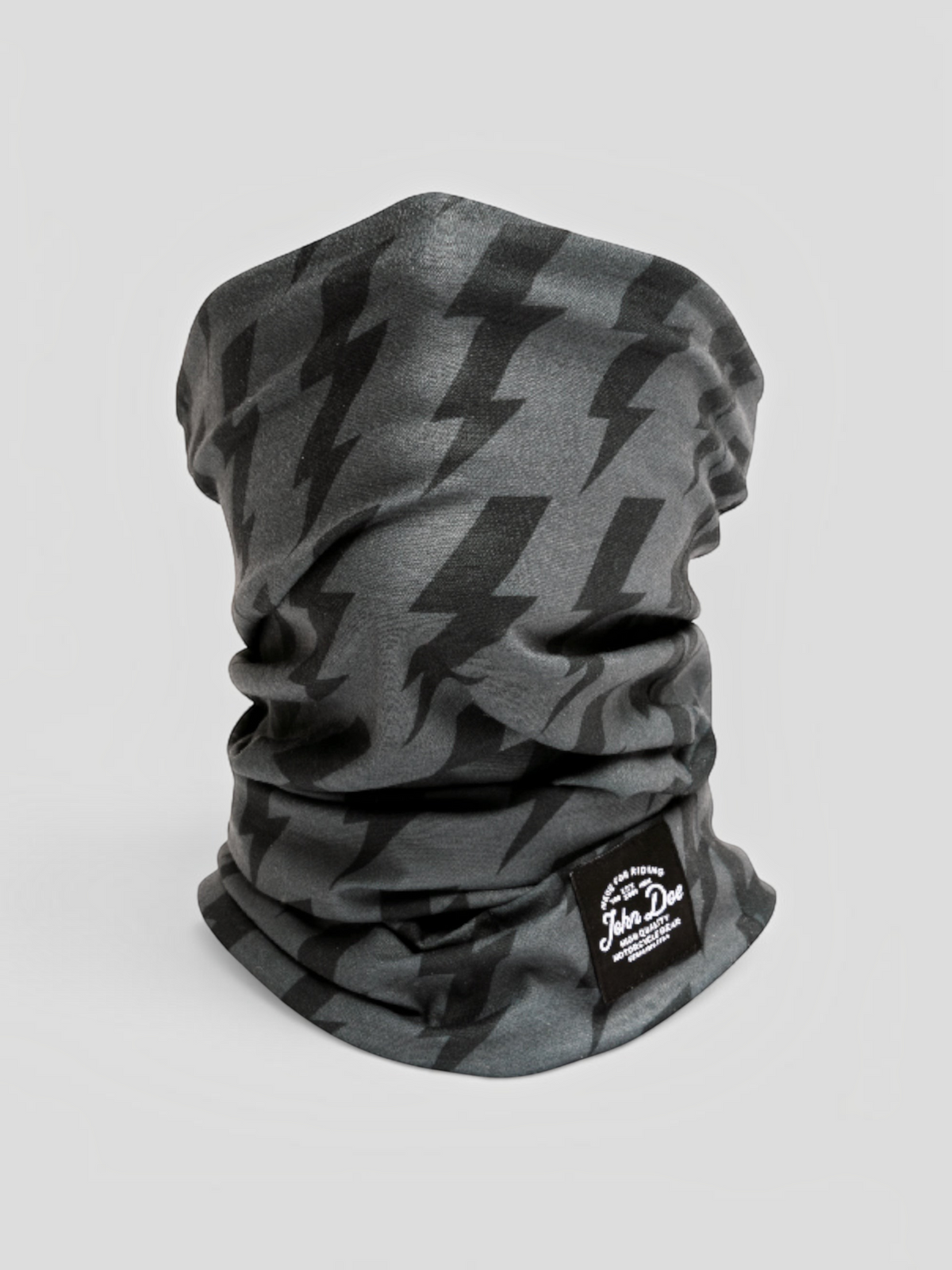Baffle Haus John Doe black and grey neck tube with a lightning bolt pattern, made from breathable microfiber.