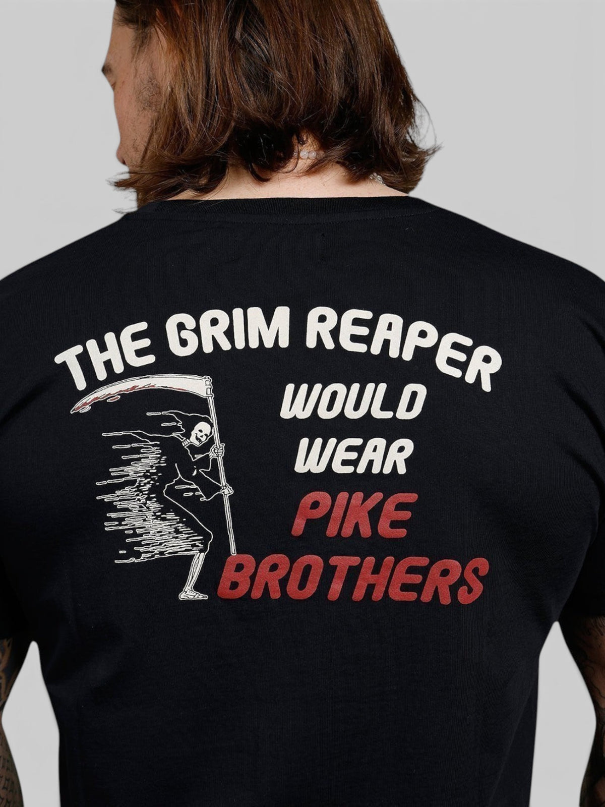 Baffle Haus black 100% cotton sports tee featuring a vintage-style Grim Reaper graphic print on the back