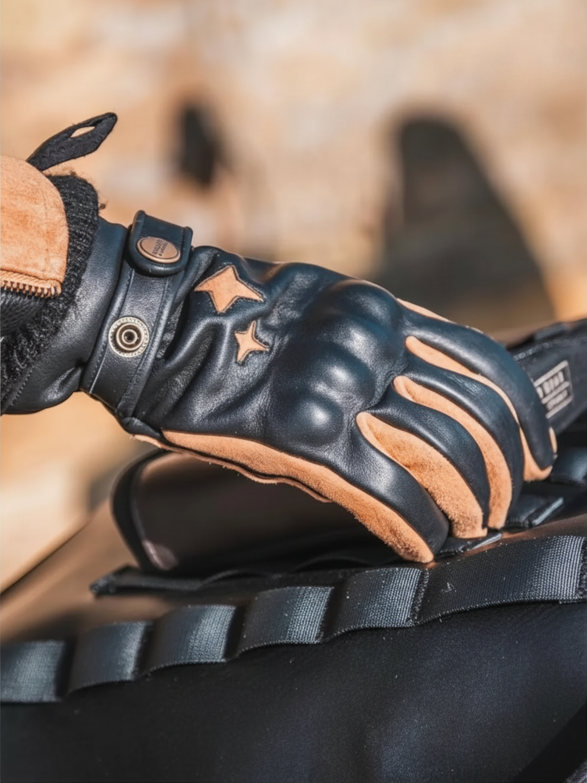 Baffle Haus KP Arizona Classic black cowhide leather motorcycle gloves with camel suede star details on the hand.