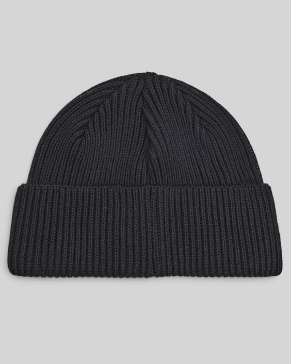 Baffle Haus Pill Merino beanie in black featuring a classic watch cap style with a double fold turnover.