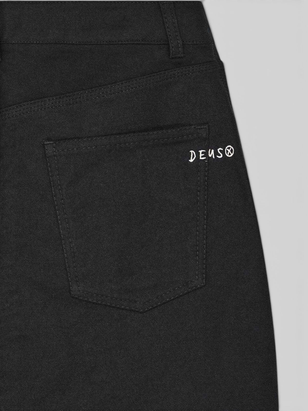Baffle Haus Outlaw Zip Mini Skirt in black rinse wash heavyweight moleskin with white Deus embroidery on back pocket