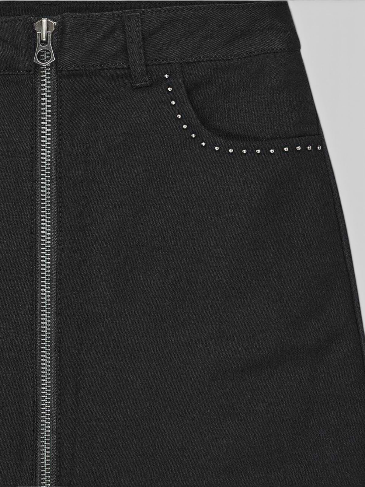Baffle Haus Outlaw black moleskin mini skirt featuring an exposed front zip and studded pocket detail.