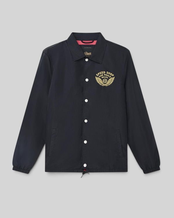 Baffle Haus Munificence black nylon coach jacket with gold graphic print on chest and snap button closure