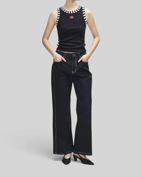 Baffle Haus black ribbed tank top with contrast stripe neck and armhole trim and small Deus shield embroidery