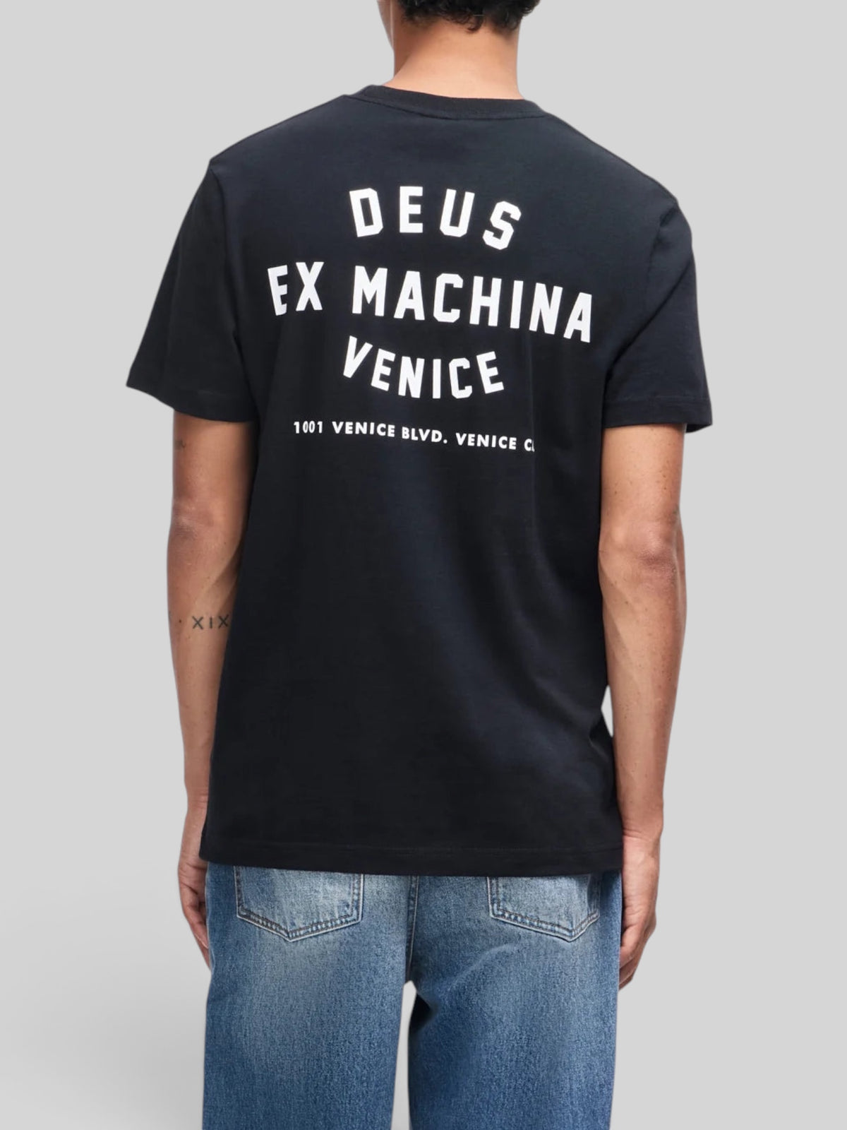 Baffle Haus black organic cotton t-shirt with white Deus Ex Machina Venice graphic print on the back