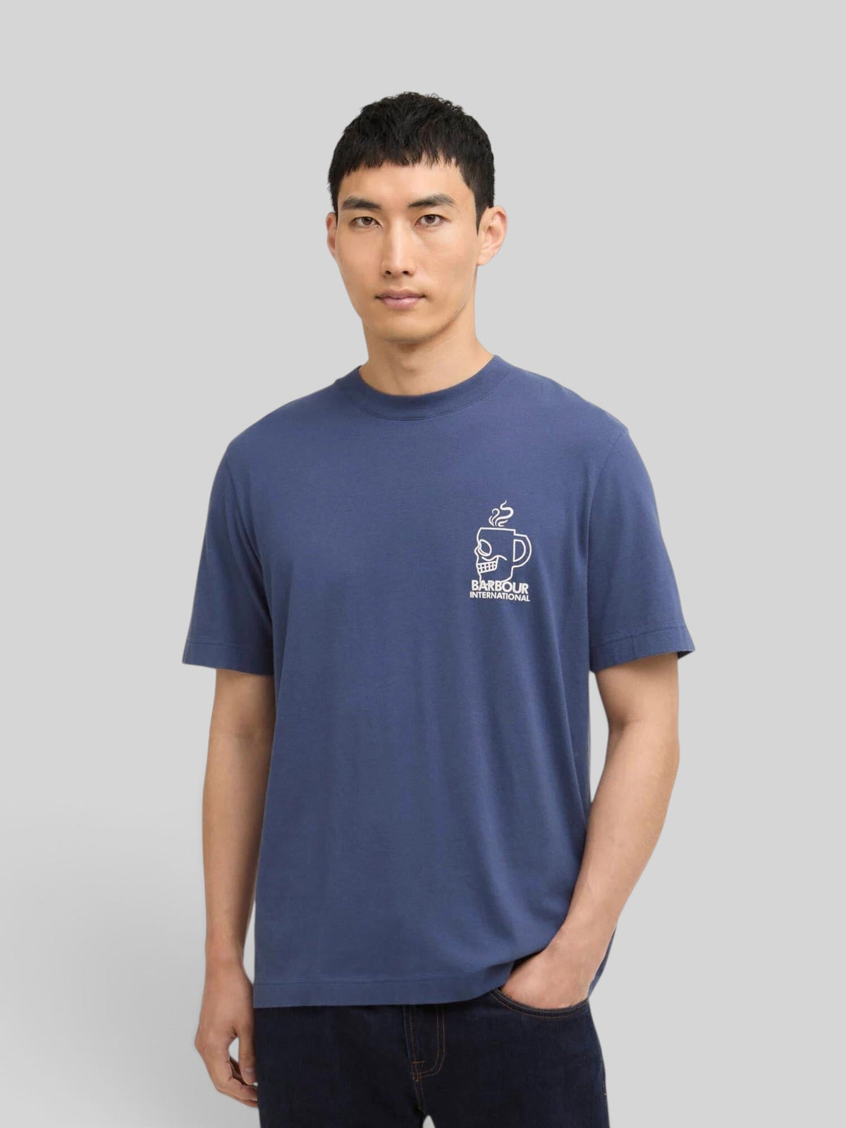 Baffle Haus model wearing a blue B.Intl Staithes graphic cotton t-shirt with a small chest logo