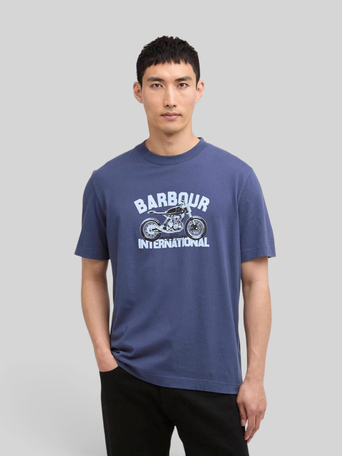 Baffle Haus International Shifter graphic print t-shirt in blue cotton with a motorcycle chest design on a model