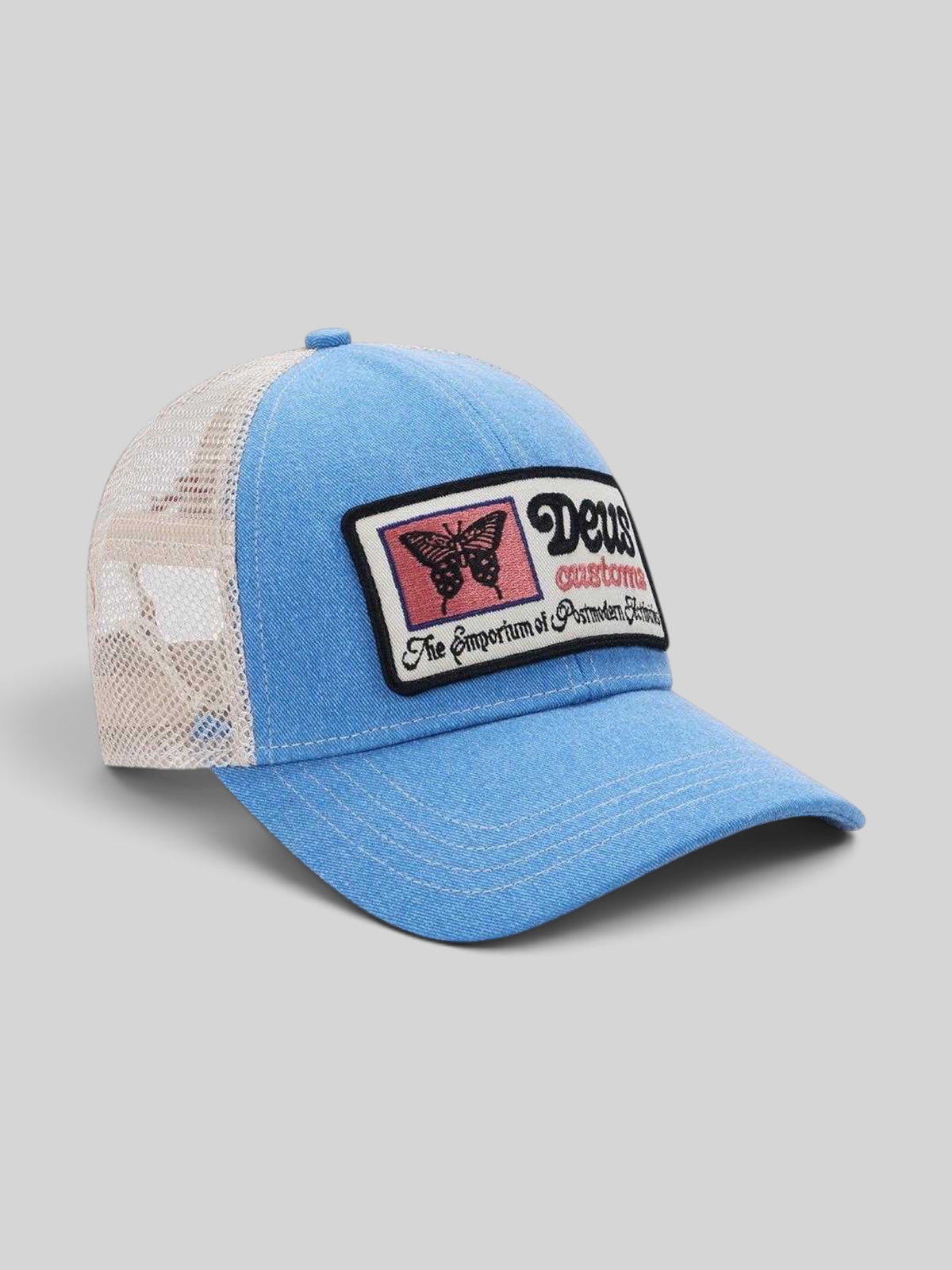 Baffle Haus Slapstick Trucker hat in Bonnie Blue with a mesh back, nylon front, and vintage-style butterfly patch.