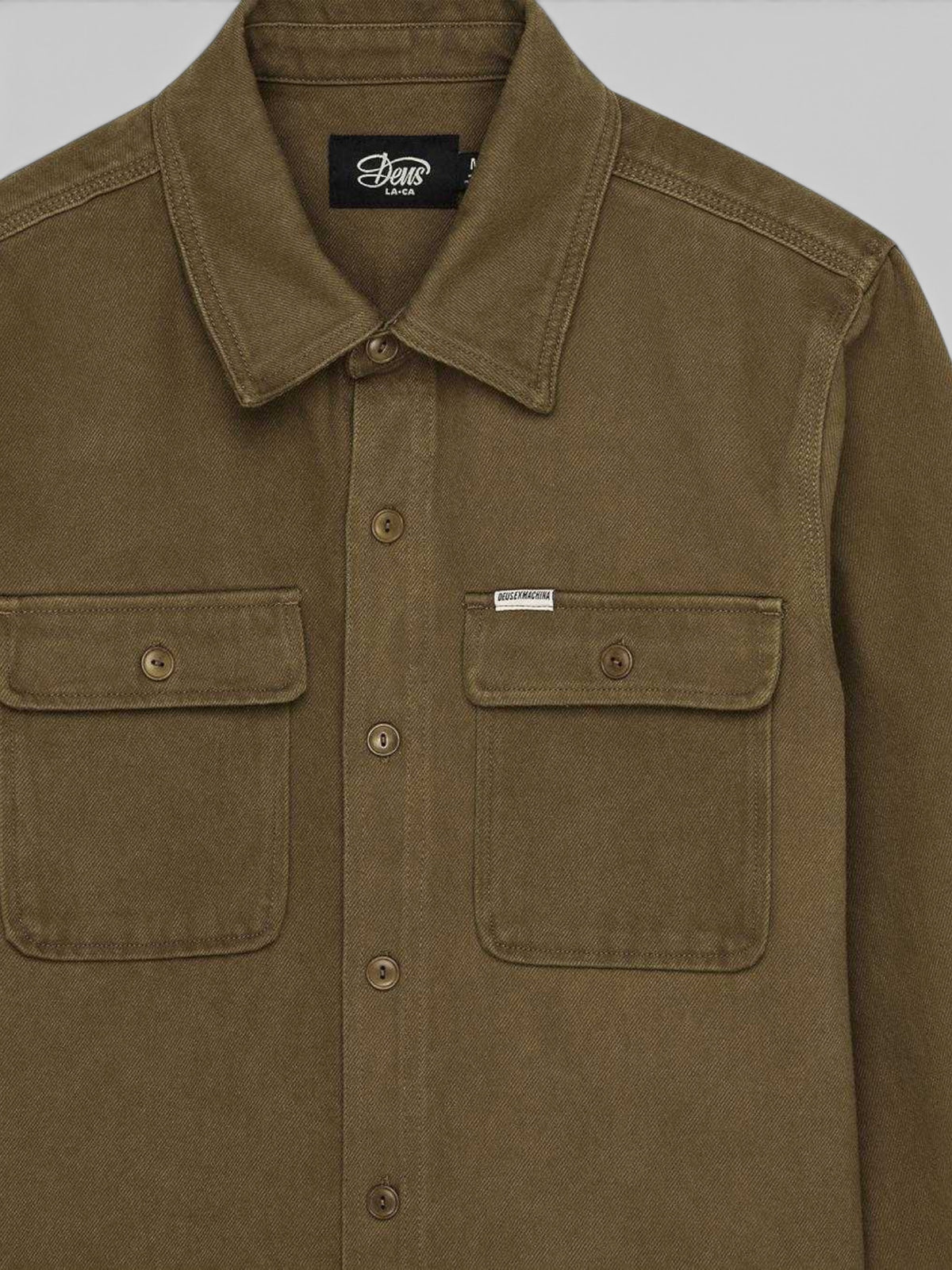 Baffle Haus Vacay Overdye Shirt in bronze brown cotton twill with dual chest pockets and corozo nut buttons.