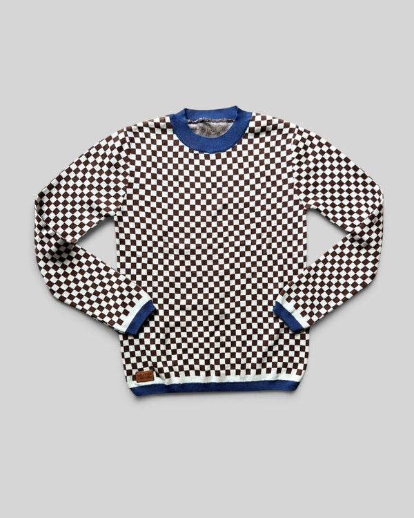 Baffle Haus vintage racing jumper in a brown and white checkerboard knit pattern with blue ribbed collar and cuffs.