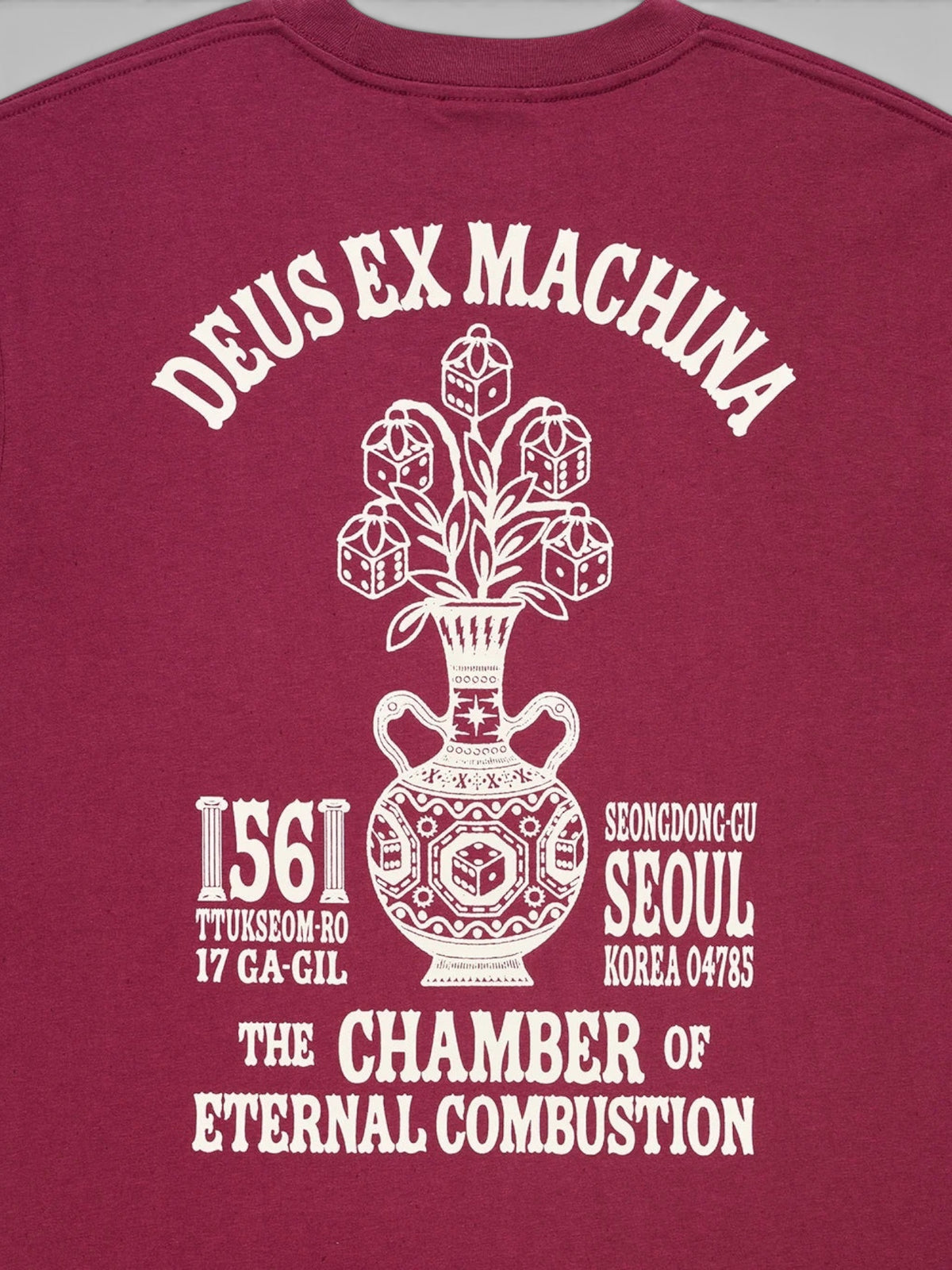 Baffle Haus Seoul Ceramic Tee in burgundy with white graphic print of a vase and dice on the back