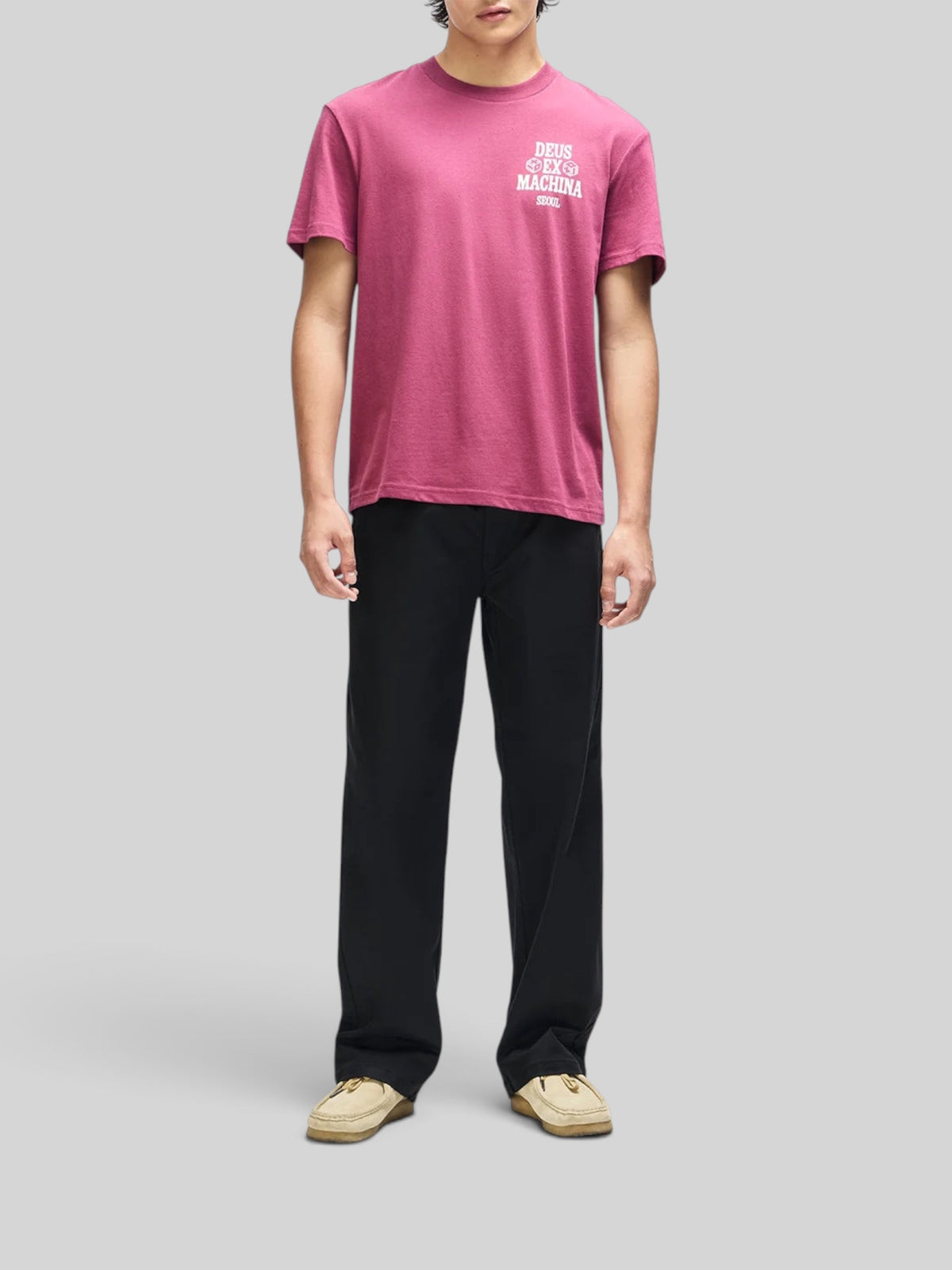 Baffle Haus burgundy box fit cropped tee with white chest graphic, worn by a model with black trousers.