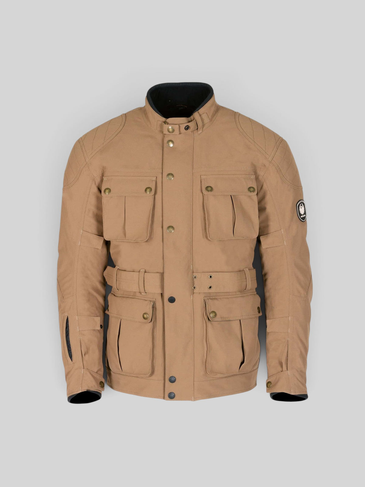 Baffle Haus Burslem Eco Sand laminated motorcycle jacket with four front pockets, waist belt, and antique brass details.