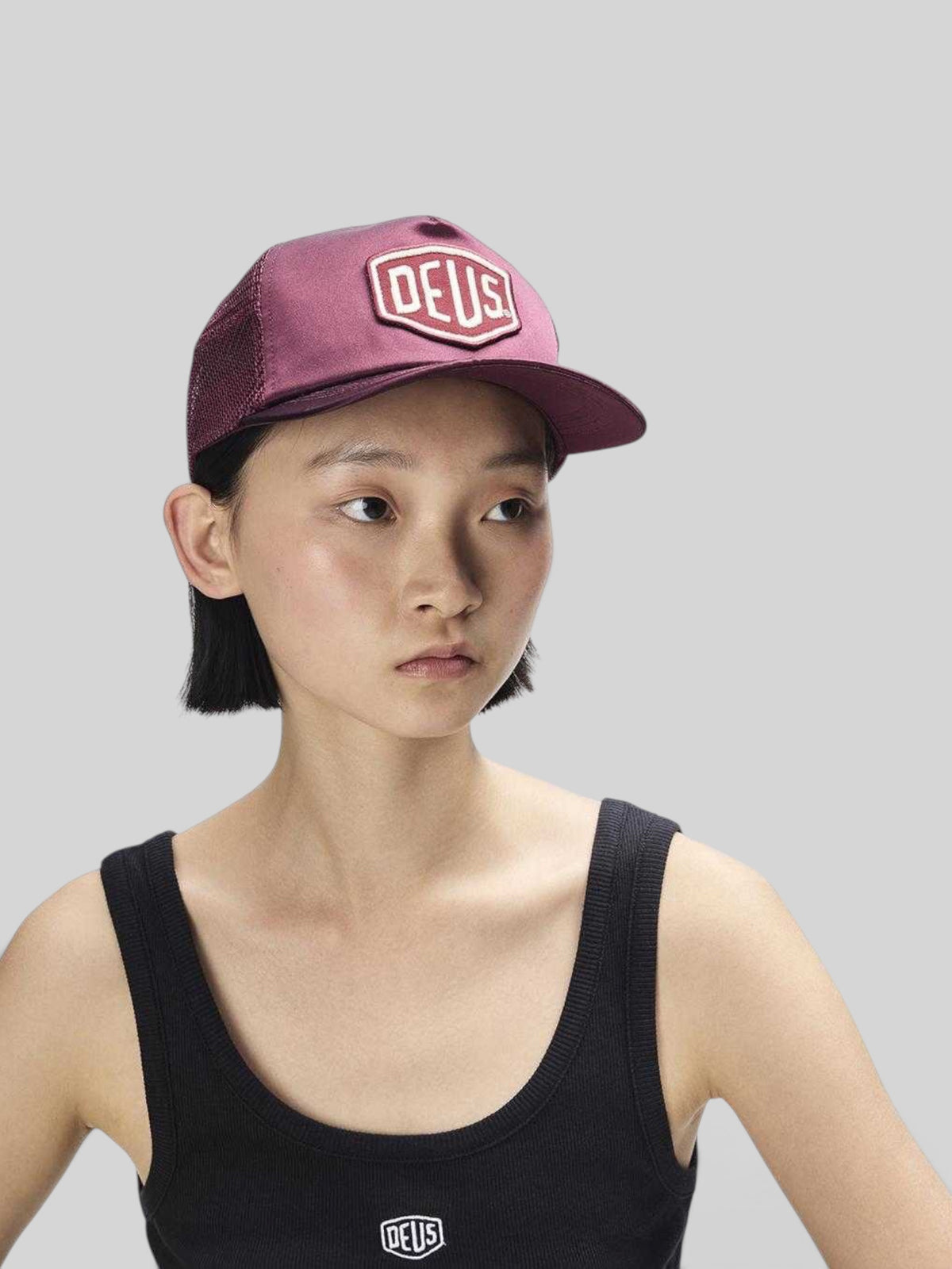 Baffle Haus Paris Shield trucker cap in cabernet red satin and mesh with a structured peak and front logo patch.