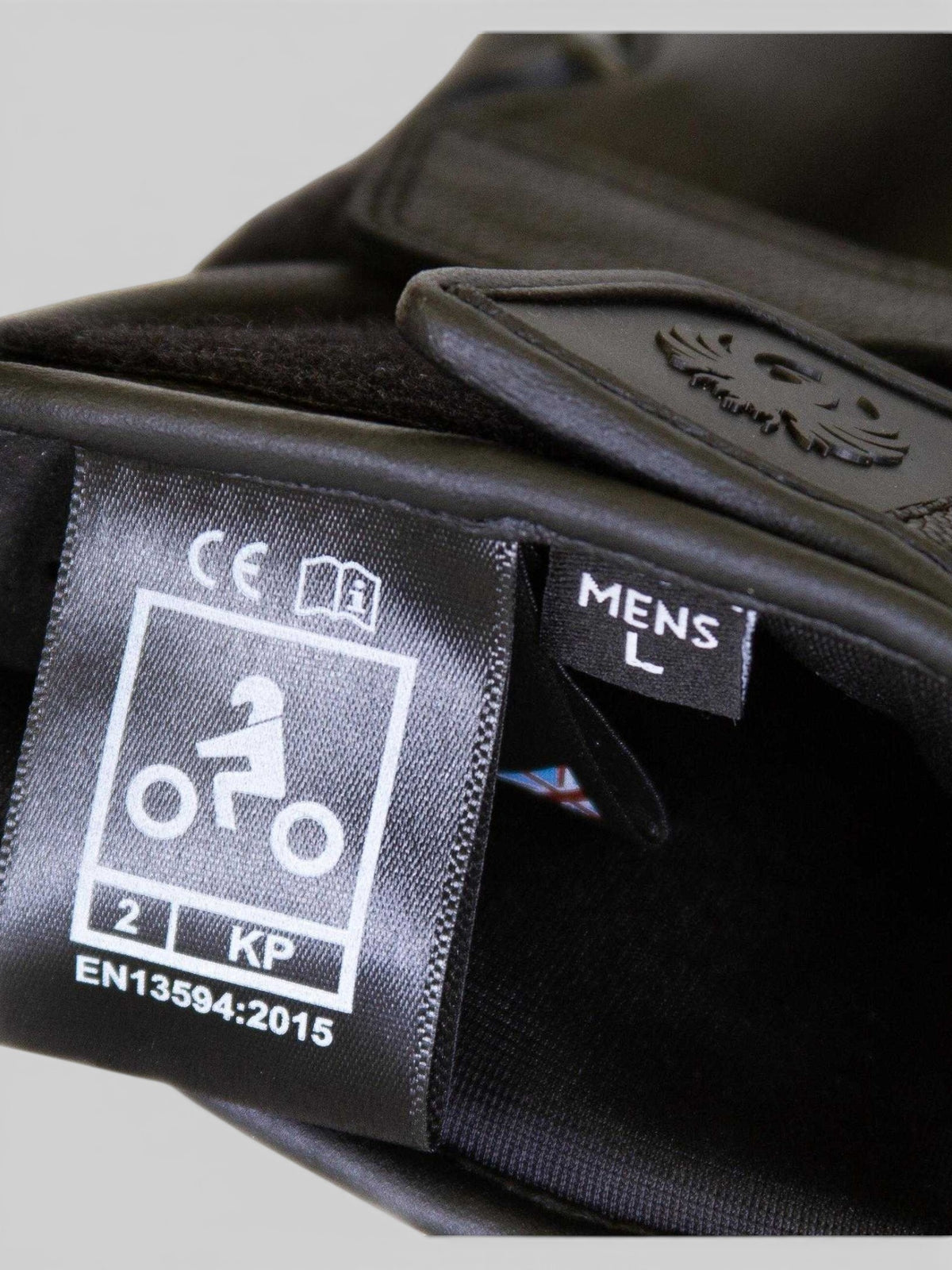 Baffle Haus Calton black leather riding glove showing CE level 2 certification label and size large tag