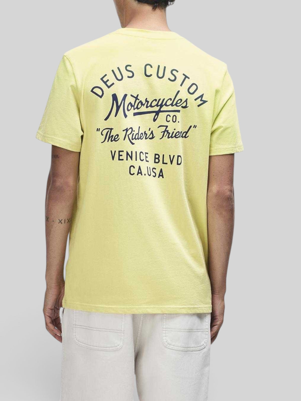 Baffle Haus Camber Tee in canary yellow with black graphic print on the back, made from recycled cotton jersey.