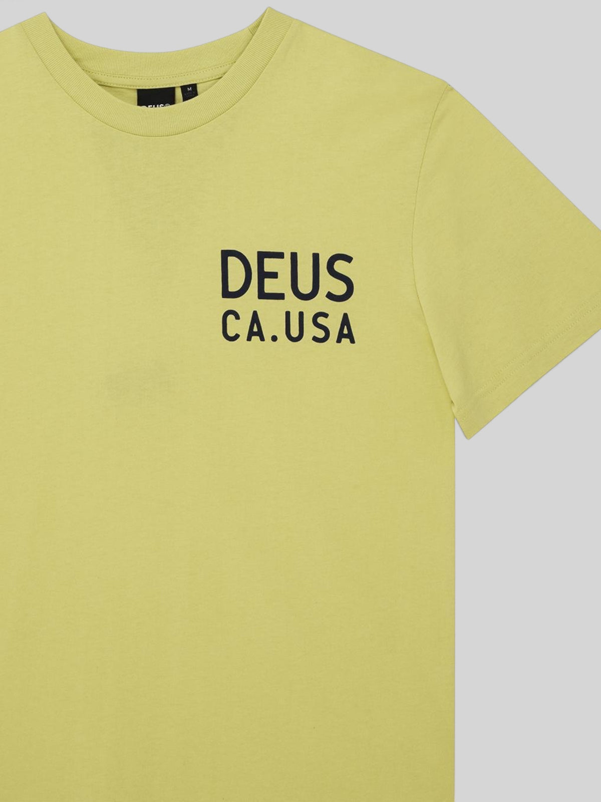 Baffle Haus Camber Tee in canary yellow featuring black Deus CA.USA chest print on organic cotton jersey fabric.