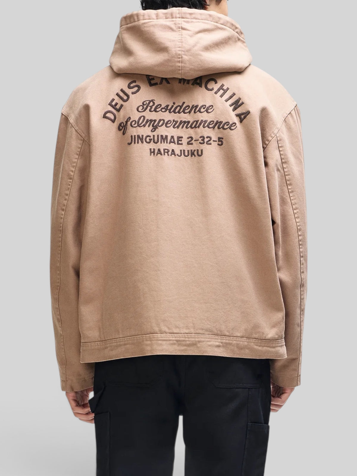 Baffle Haus camel brown cotton canvas hooded work jacket with embroidered Deus Ex Machina back graphic
