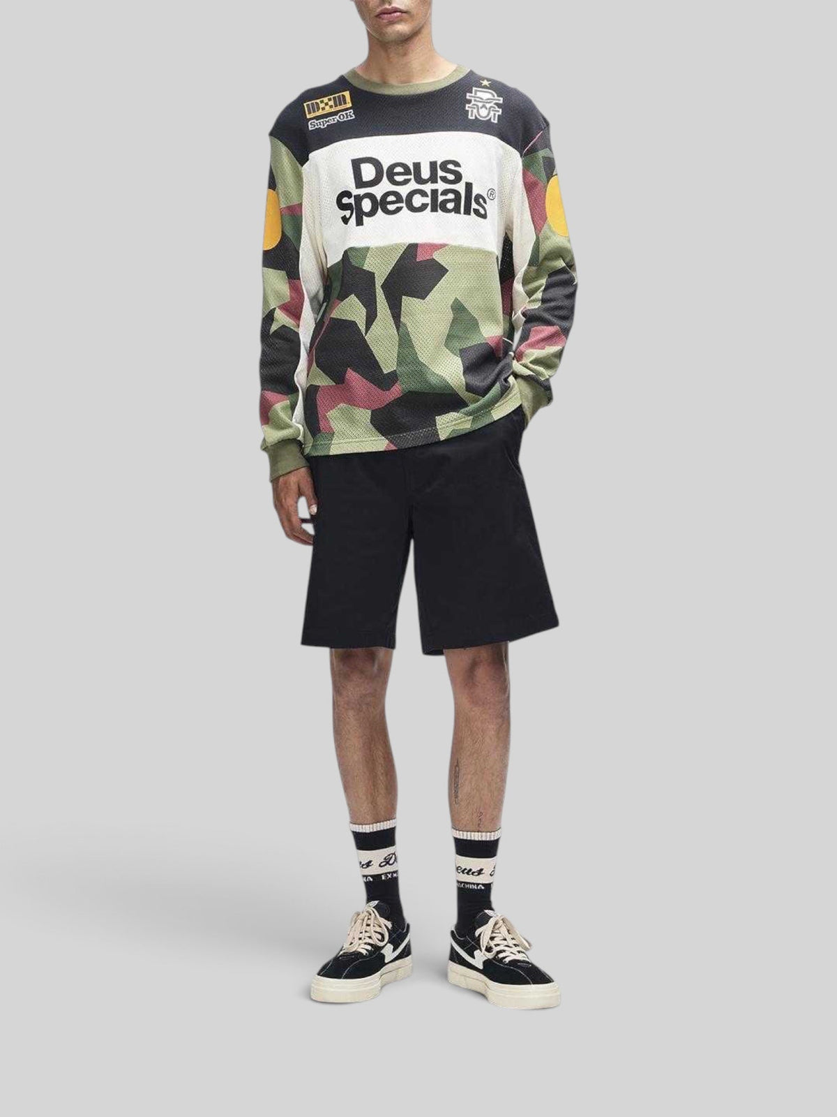 Baffle Haus Colt Ryder oversized camo moto jersey in polyester mesh with retro graphic prints on a male model