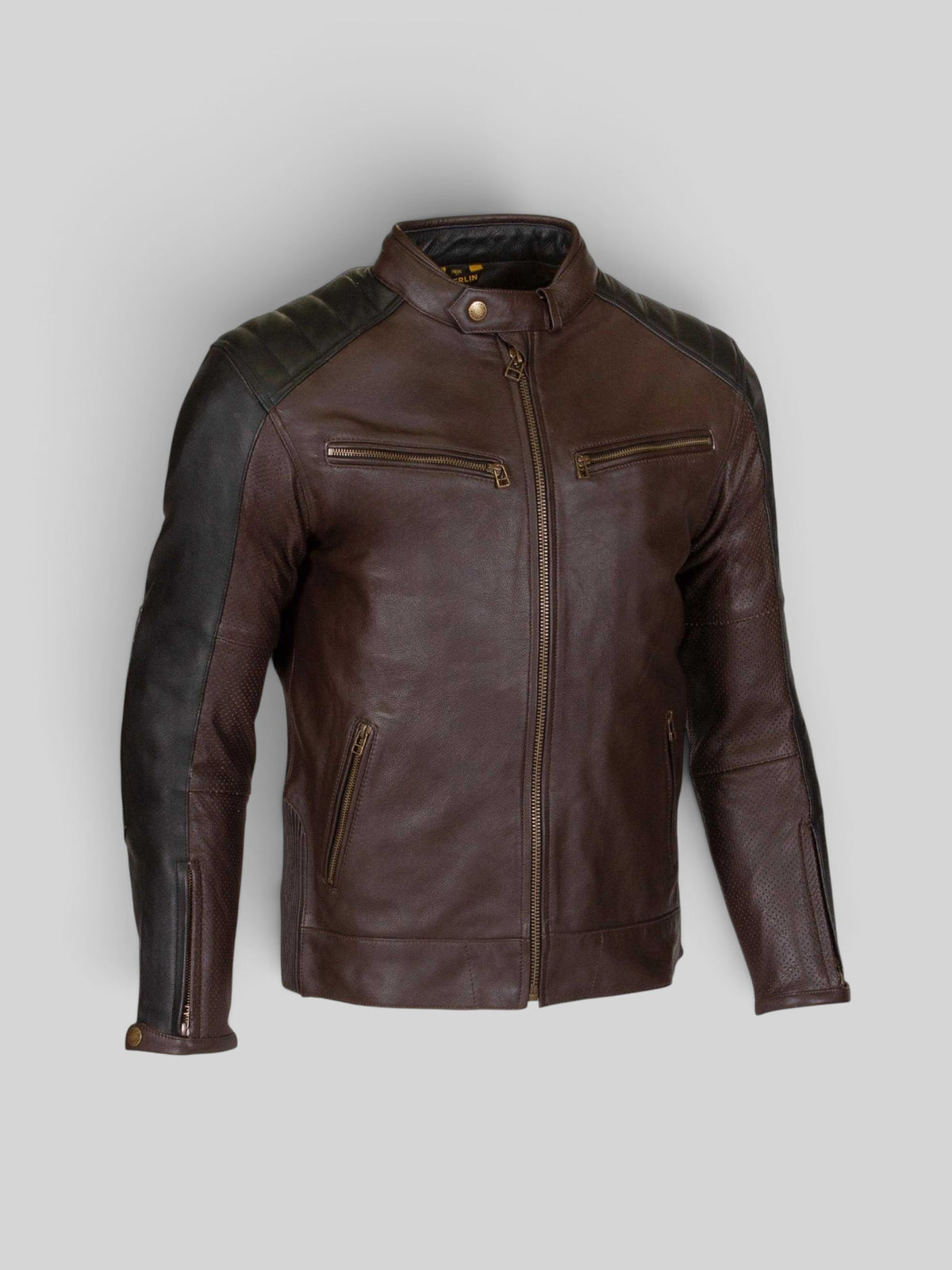 Baffle Haus Chase D30 leather motorcycle jacket in brown and black with perforated panels and antique brass zippers.