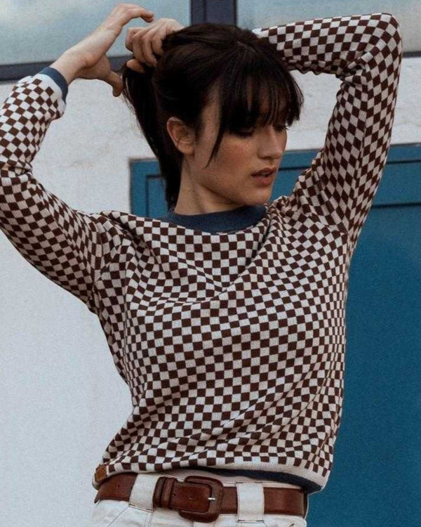 Baffle Haus vintage racing jumper in coffee brown and beige checkerboard cotton knit worn by a woman