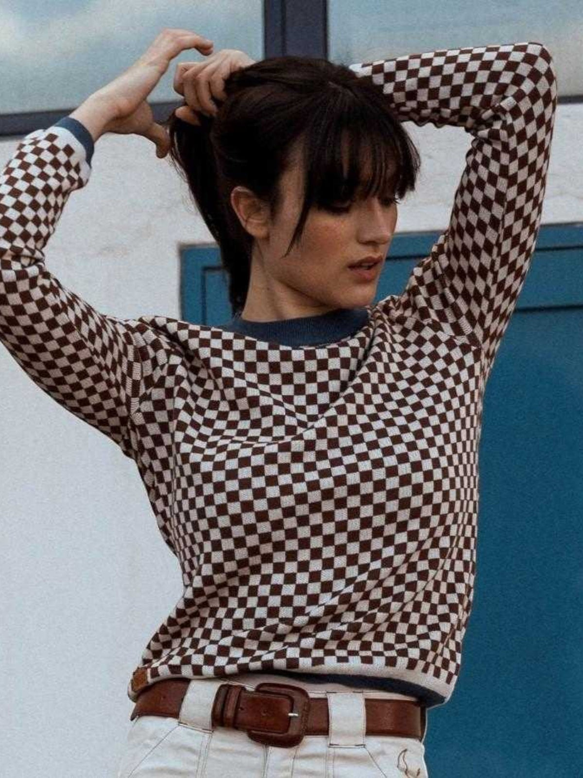 Baffle Haus vintage racing jumper in coffee brown and beige checkerboard cotton knit worn by a woman