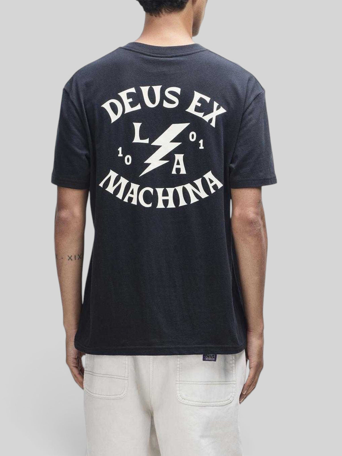 Baffle Haus Chinook black box fit t-shirt with white Deus Ex Machina graphic print on the back