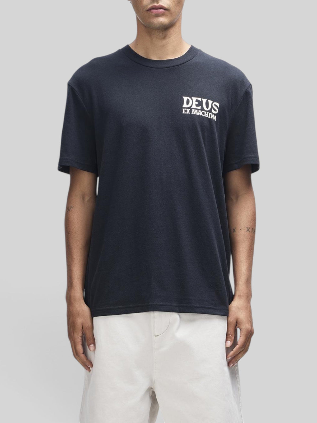 Baffle Haus Chinook Tee in black recycled cotton blend with white Deus Ex Machina chest logo in a boxy fit