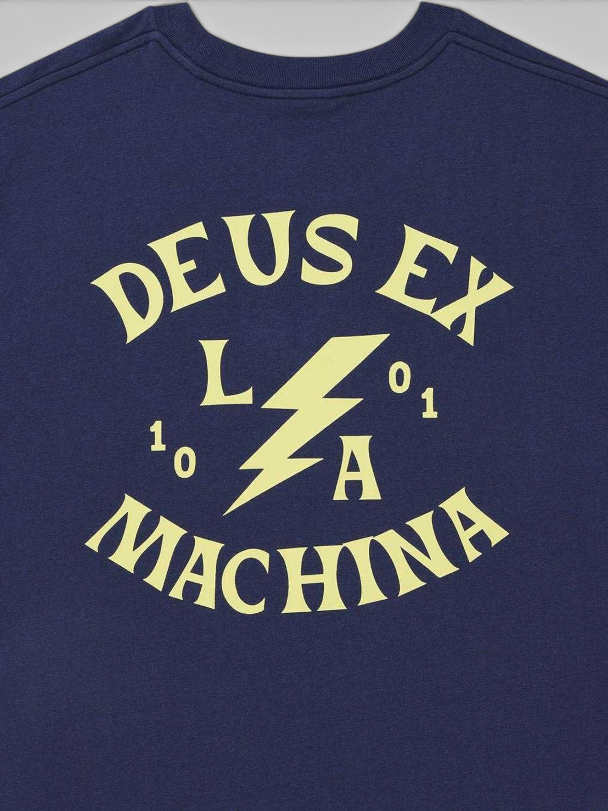Baffle Haus Chinook Tee in mechanic blue featuring yellow Deus Ex Machina lightning bolt graphic on the back