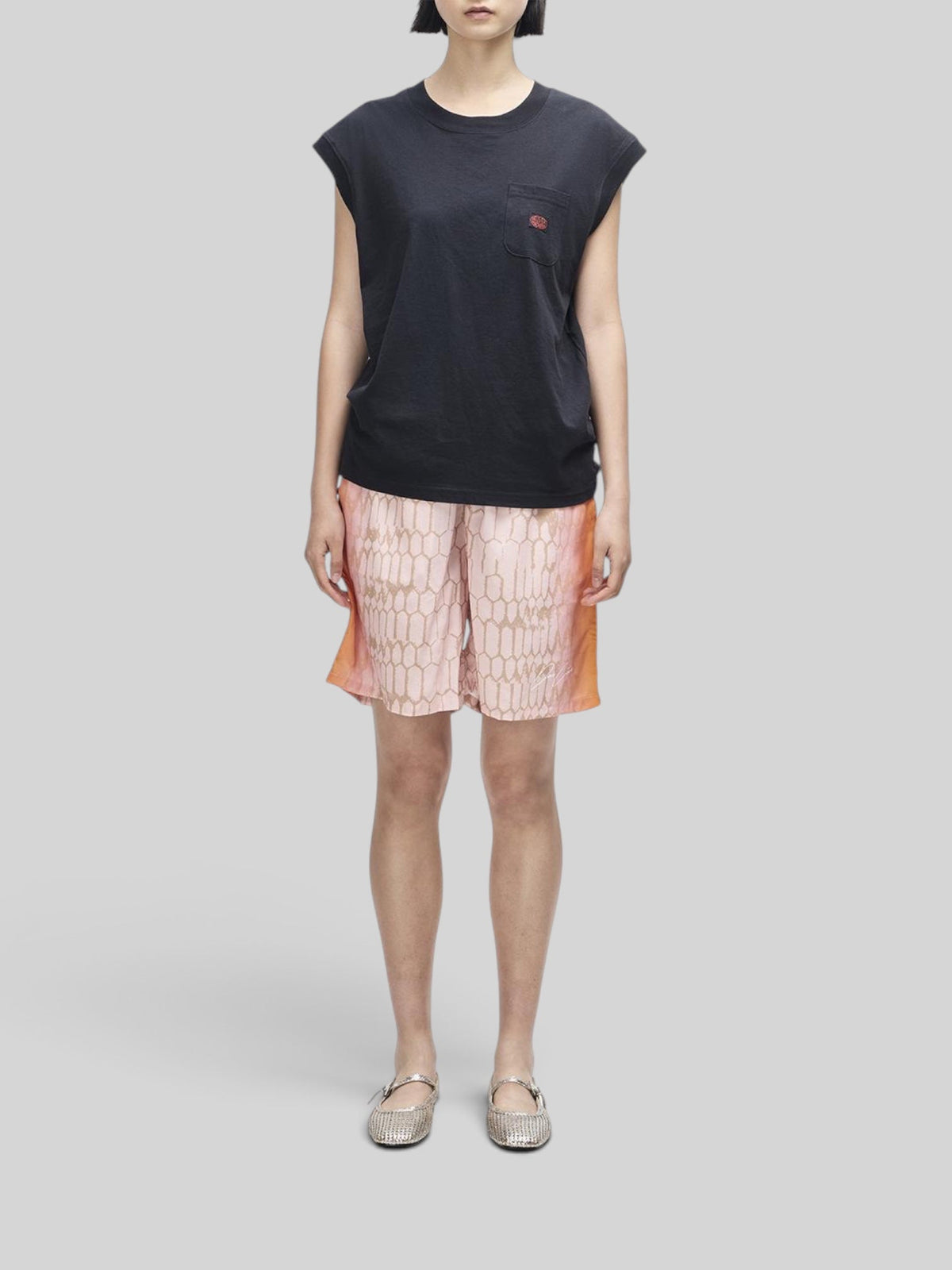 Baffle Haus Christine tank in black recycled cotton blend with cap sleeves and a small chest pocket.