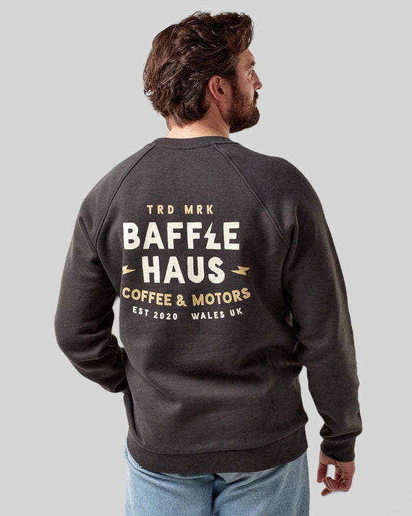 Baffle Haus Coffee & Motors sweatshirt in printers ink grey with back graphic print worn by a man