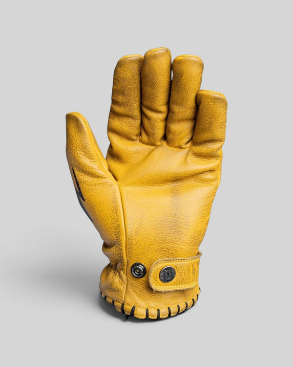 Baffle Haus Coyote yellow cowhide leather motorcycle gloves with adjustable wrist strap and stitched cuff detail