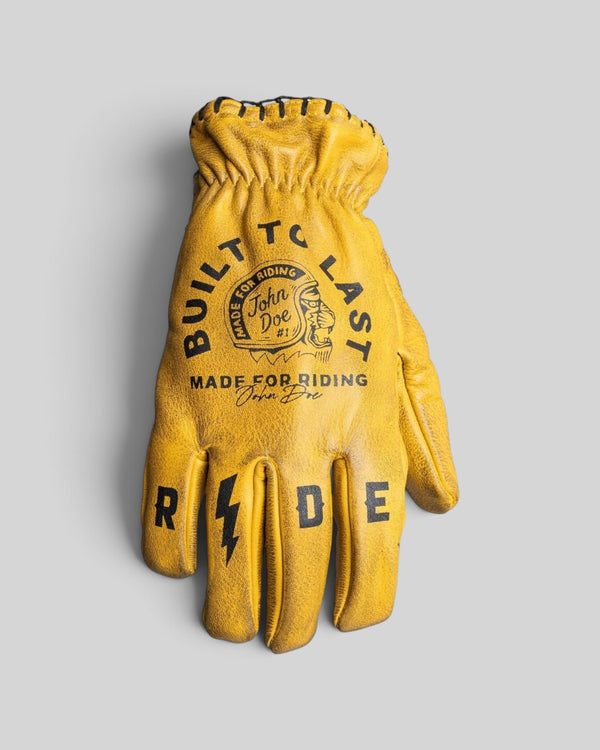 Baffle Haus John Doe Coyote yellow cowhide leather motorcycle gloves with black graphic print and retro short cuff