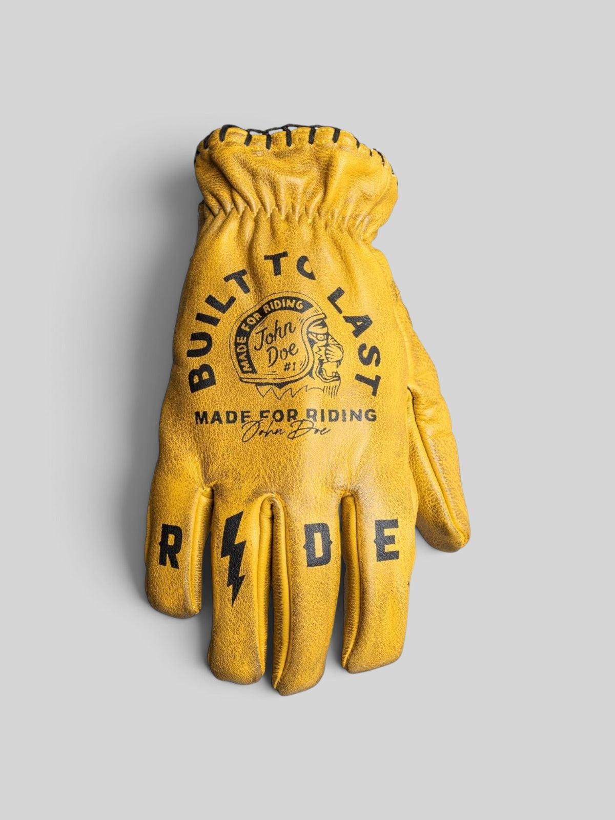 Baffle Haus John Doe Coyote yellow cowhide leather motorcycle gloves with black graphic print and retro short cuff