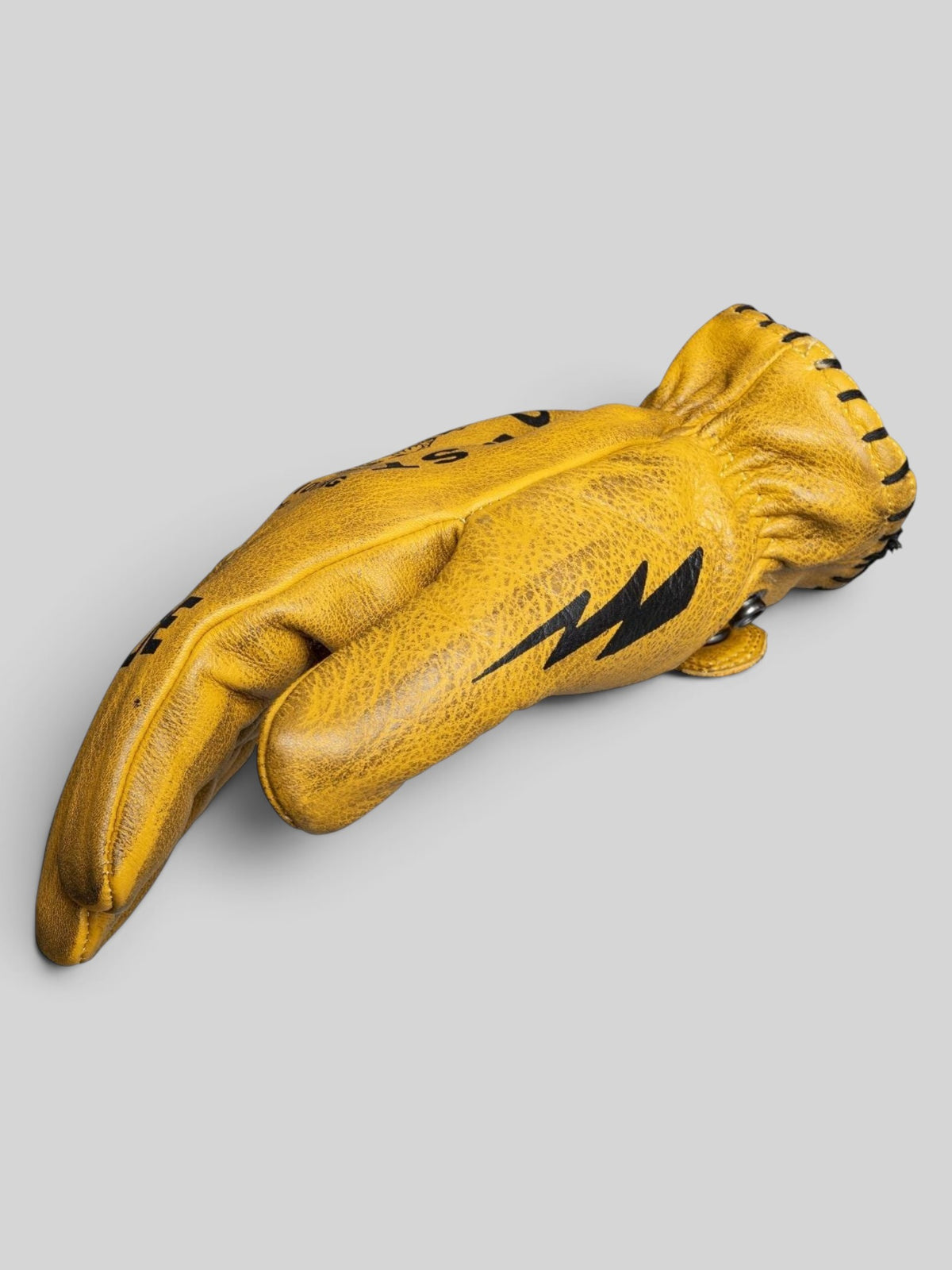 Baffle Haus Coyote yellow cowhide leather motorcycle gloves with black lightning bolt detail and retro short cuff