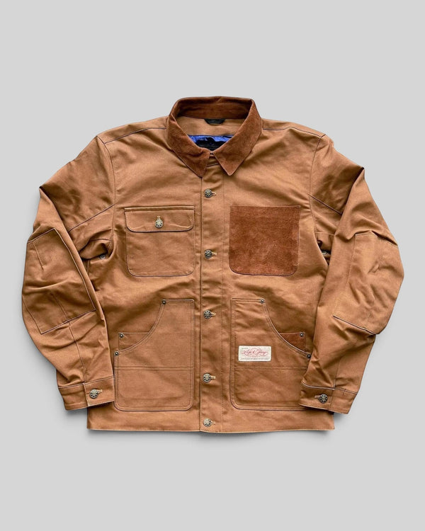 Baffle Haus Age Of Glory Craftsman jacket in caramel with brass buttons, suede pocket detail, and durable workwear style