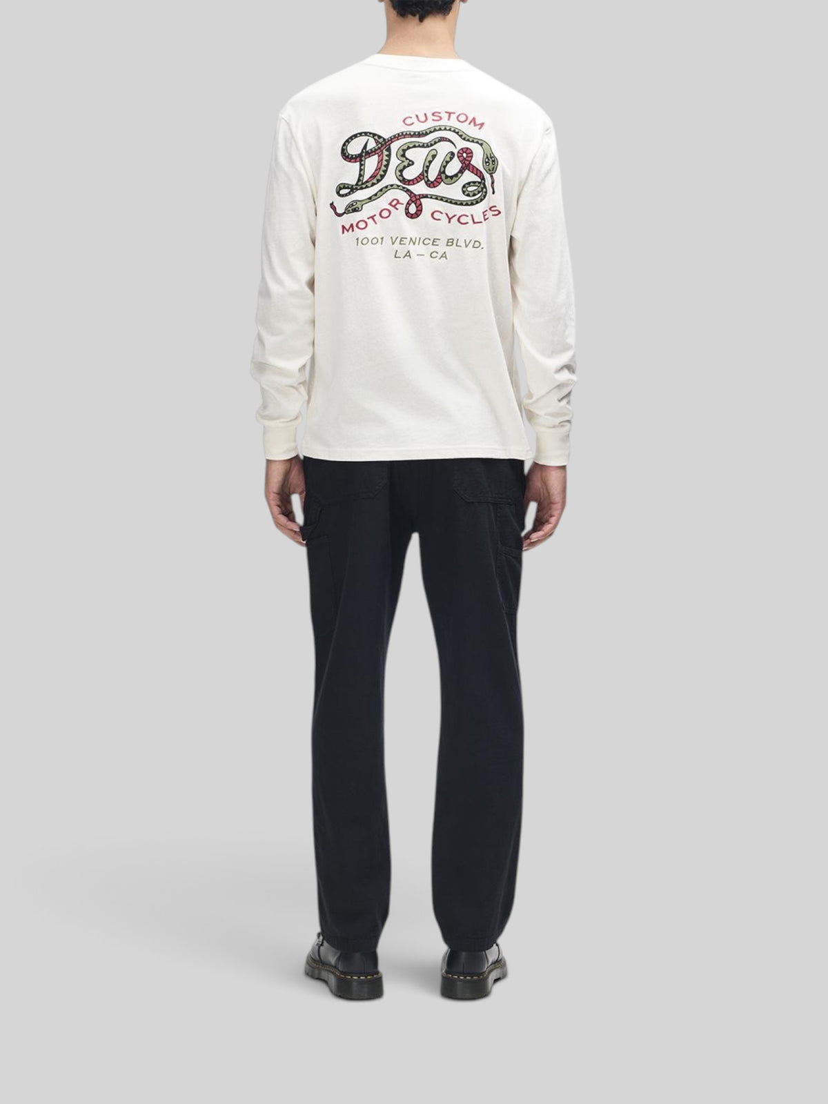 Baffle Haus Danger Noodle long sleeve tee in dirty white with back graphic of a snake and Deus motorcycle branding