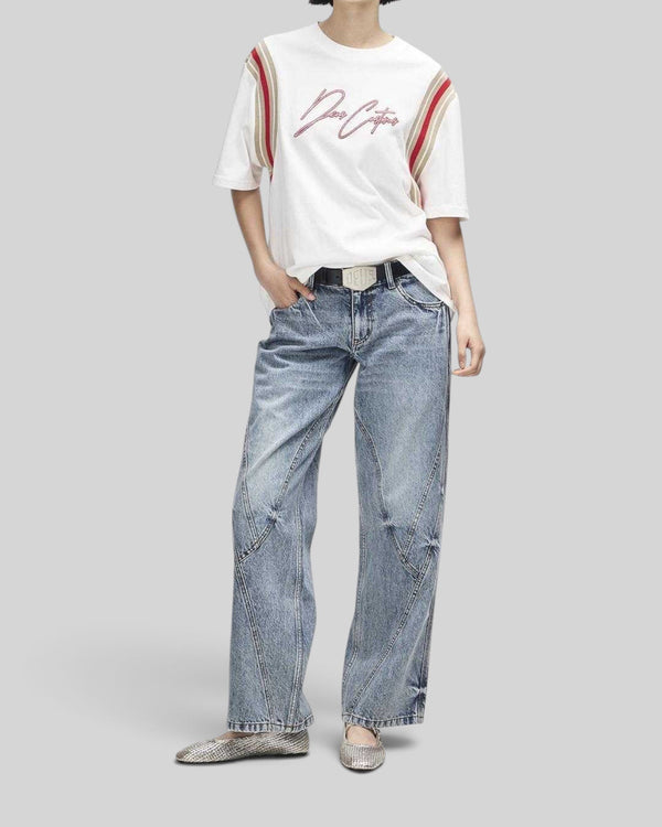 Baffle Haus Debute Tee in antique white with red and beige sleeve stripes and front embroidery on a female model