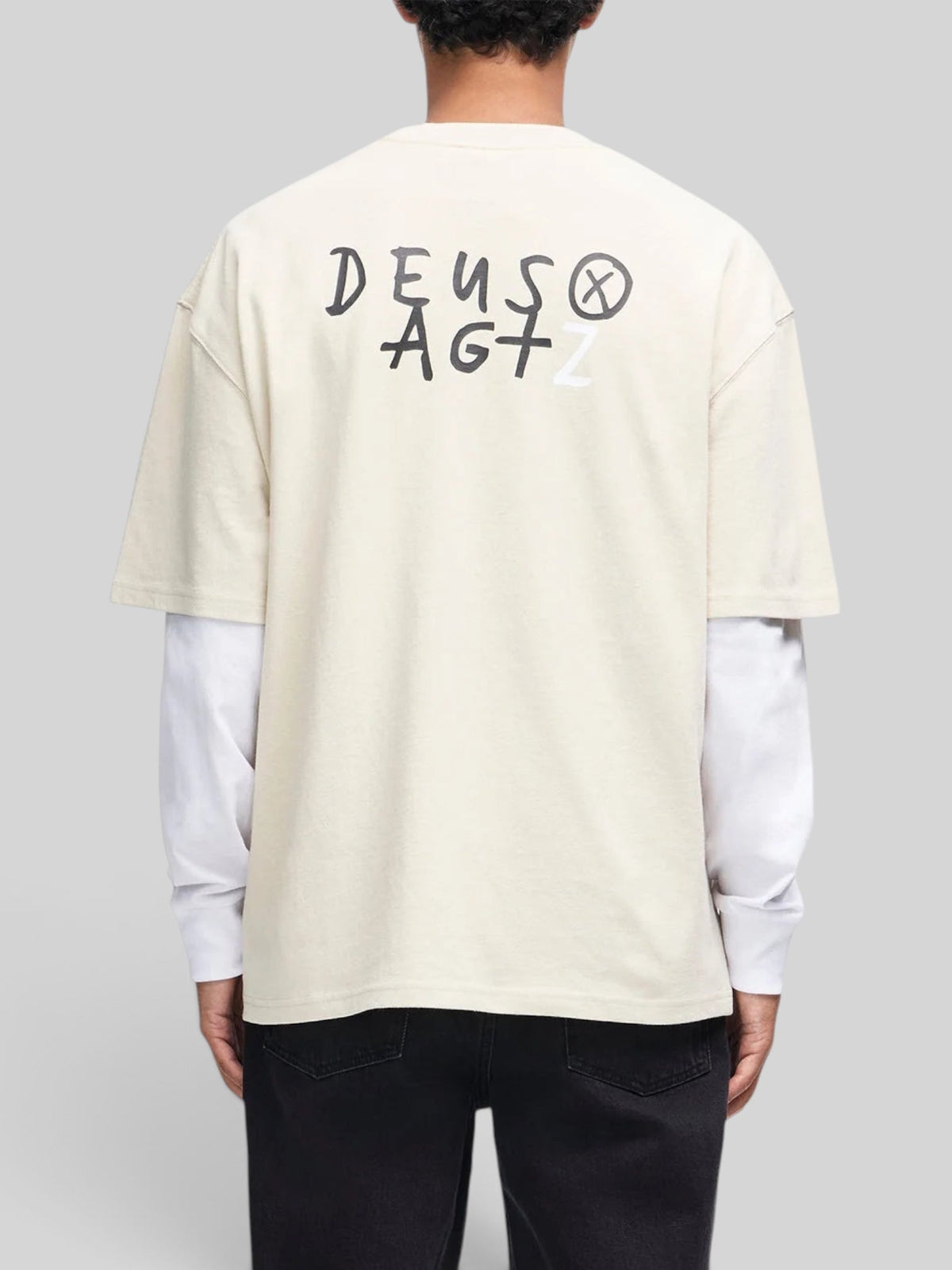 Baffle Haus Deus x AGTZ oversized bone white cotton t-shirt with back graphic print worn by a model