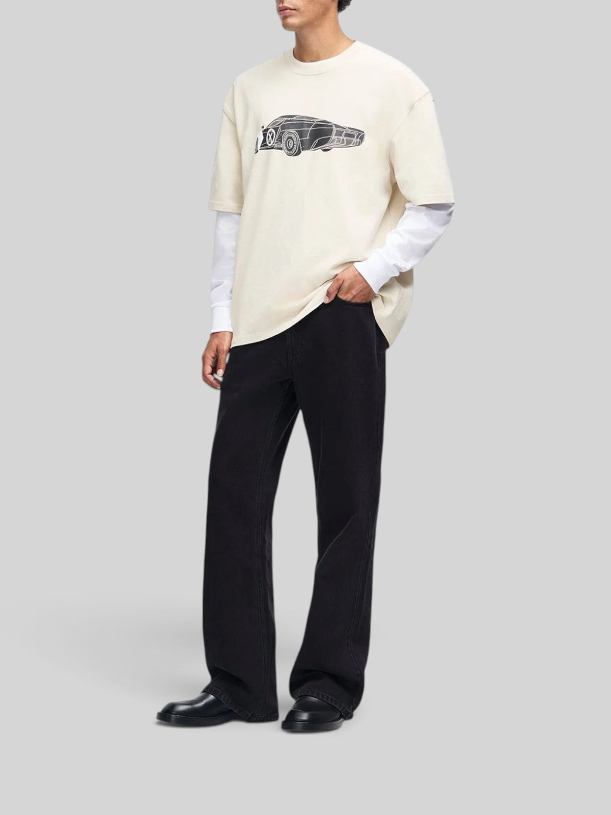Baffle Haus Deus x AGTZ oversized bone white cotton t-shirt with graphic car print worn by a model