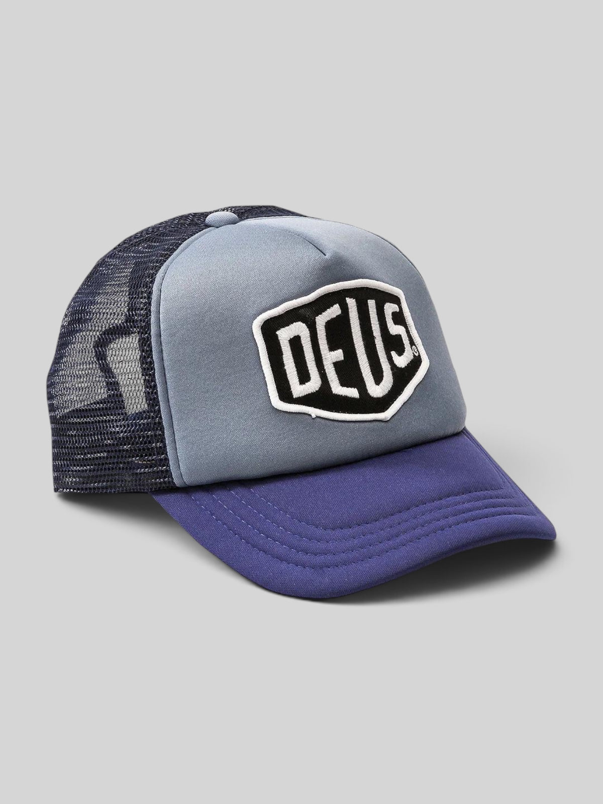 Baffle Haus Deus Baylands trucker cap in blue and navy with mesh back and embroidered front logo patch