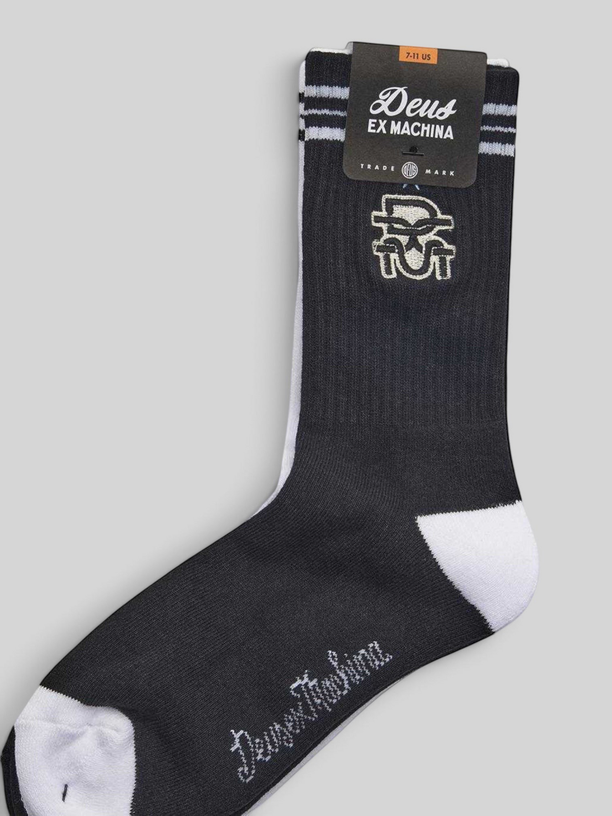Baffle Haus Deus Ex Machina black and white cotton blend crew socks with jacquard logo and ribbed ankle detail.