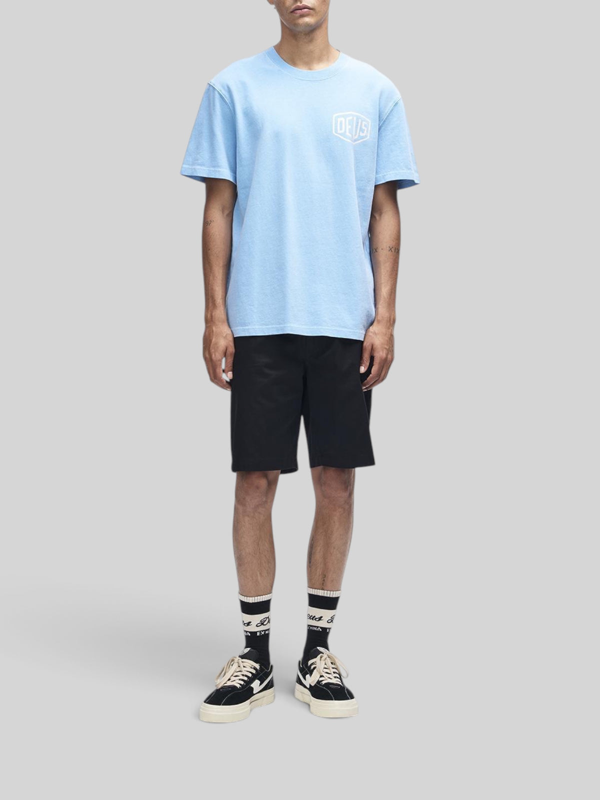 Baffle Haus Deus Shield garment dyed box fit t-shirt in bonnie blue with chest logo print on a male model