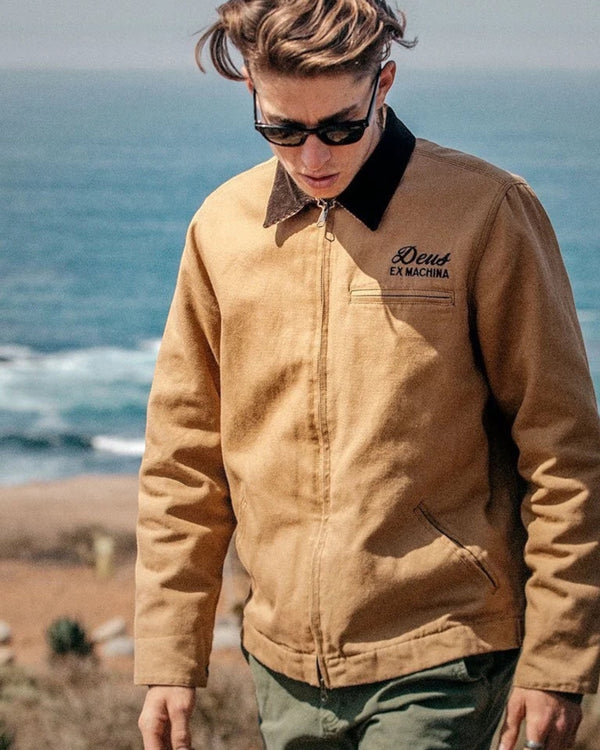 Baffle Haus dijon tan cotton canvas workwear jacket with zip closure and embroidered Deus Ex Machina logo
