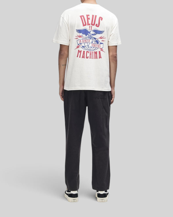 Baffle Haus dirty white box fit t-shirt with graphic print on back, worn with black trousers and sneakers