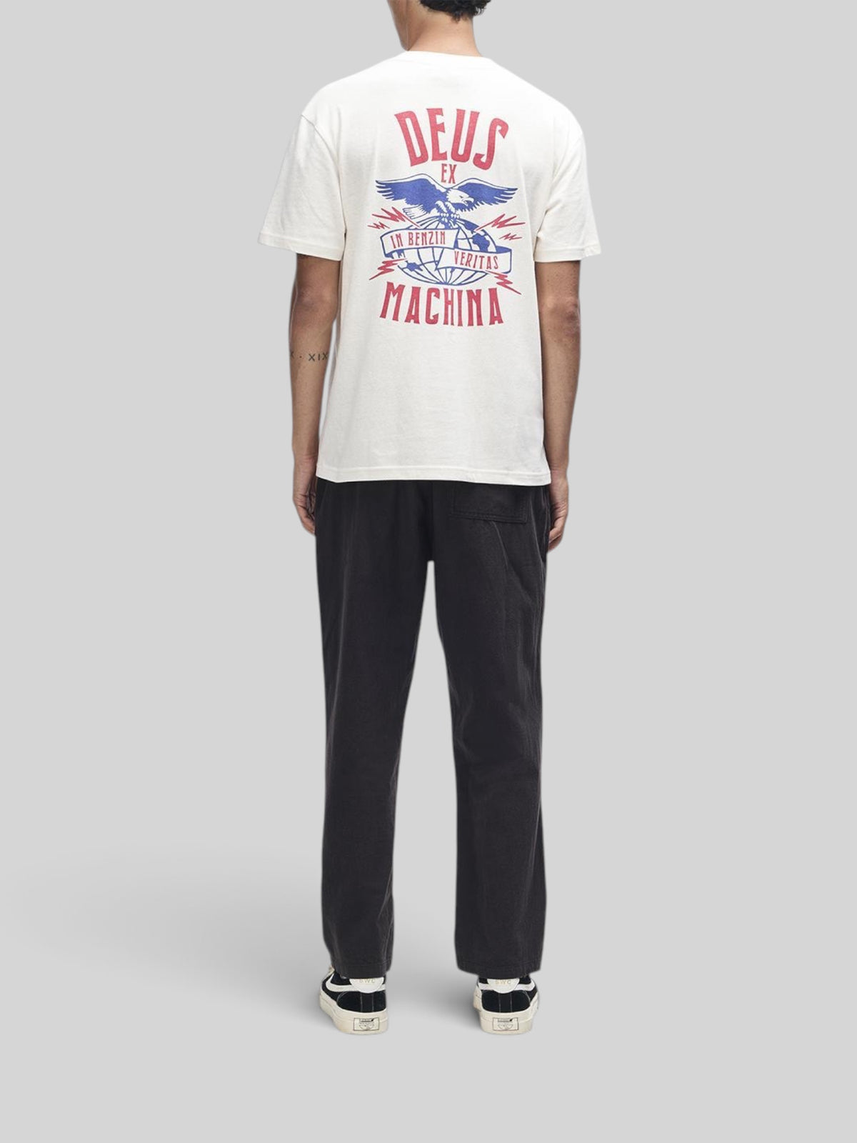 Baffle Haus dirty white box fit t-shirt with graphic print on back, worn with black trousers and sneakers