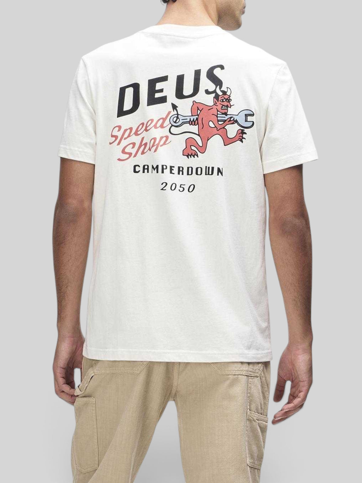 Baffle Haus Deus Dogleg Tee in dirty white featuring a red devil graphic with a wrench on the back